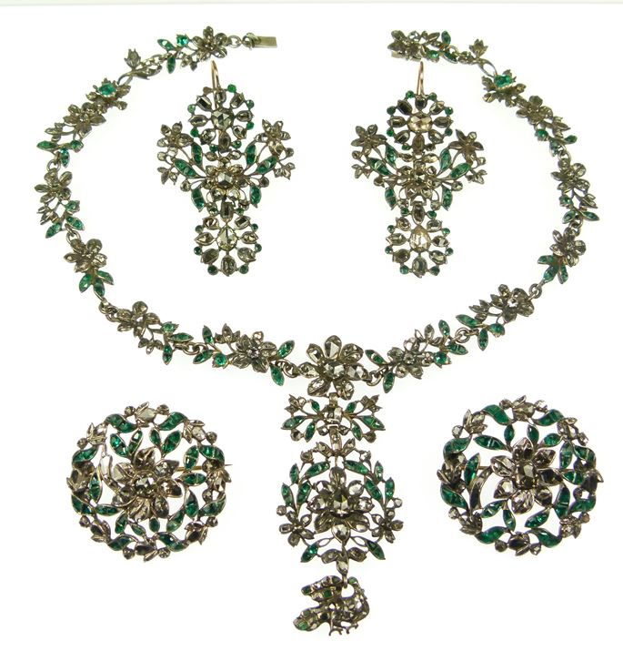 Emerald and diamond floral and foliate cluster suite, comprising a necklace, two brooches and a pair of earrings | MasterArt